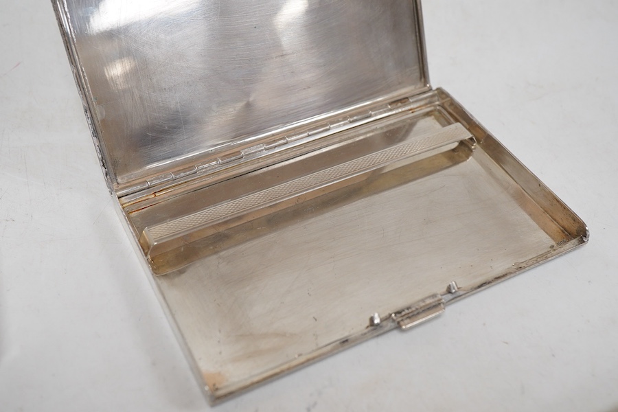 An engine turned 800 standard white metal cigarette case, 12cm, a 1920's Russian 875 standard white metal cigarette case and a white metal paper knife or page turner.